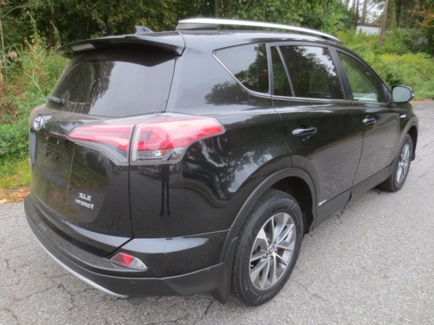 2016 Black /Black Toyota RAV4 Hybrid XLE (JTMRJREV5GD) with an 2.5L L4 DOHC 16V HYBRID engine, Automatic transmission, located at 270 US Route 6, Mahopac, NY, 10541, (845) 621-0895, 41.349022, -73.755280 - Photo#3