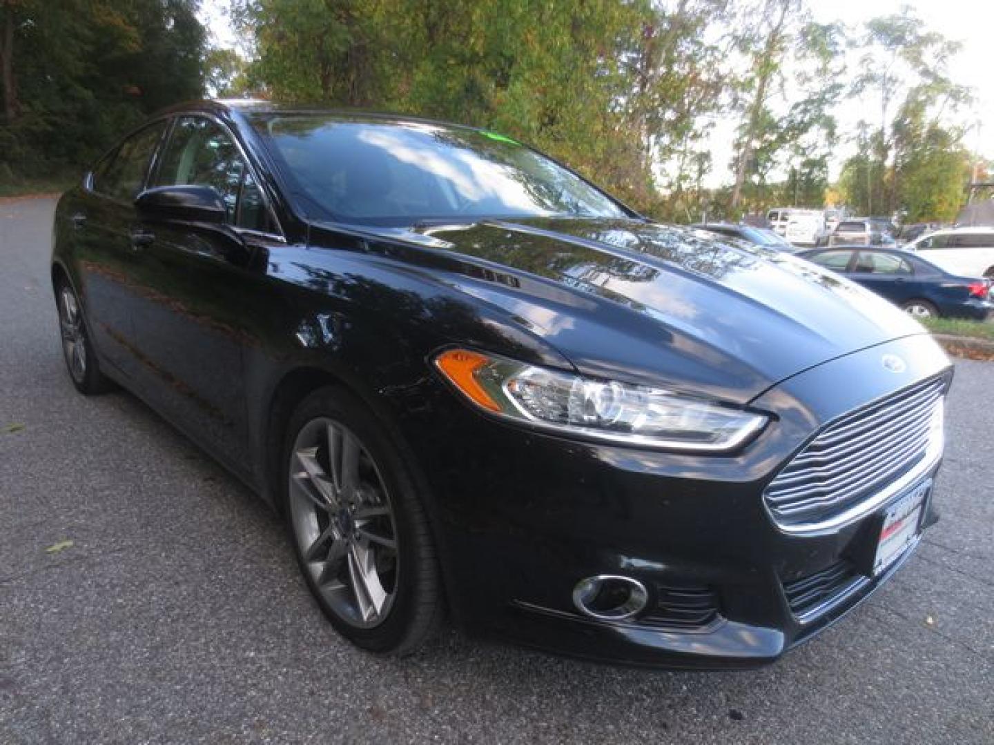 2016 Black /Black Ford Fusion Titanium (3FA6P0D90GR) with an 2.0L L4 DOHC 16V engine, Automatic transmission, located at 270 US Route 6, Mahopac, NY, 10541, (845) 621-0895, 41.349022, -73.755280 - Photo#1